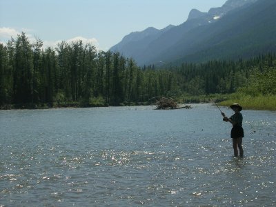 Terry, stream fishing for Cutthroat, Fish On!